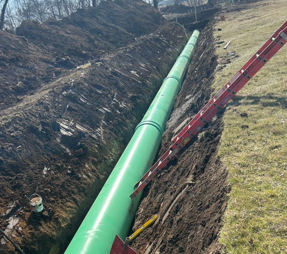 Green gravity sewer pipe laid in a long trench