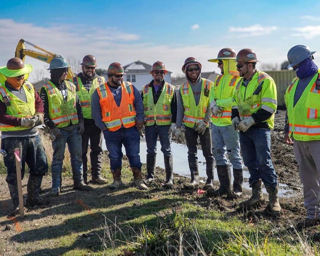 Acadia field crew group photo on a job site