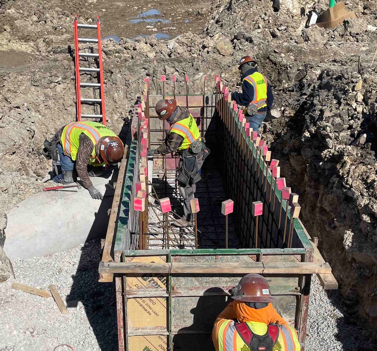 Crew building reinforced forms for a site utility structure