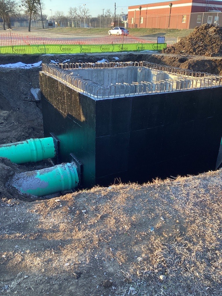 Concrete structure with sewer connections at the Elkins project
